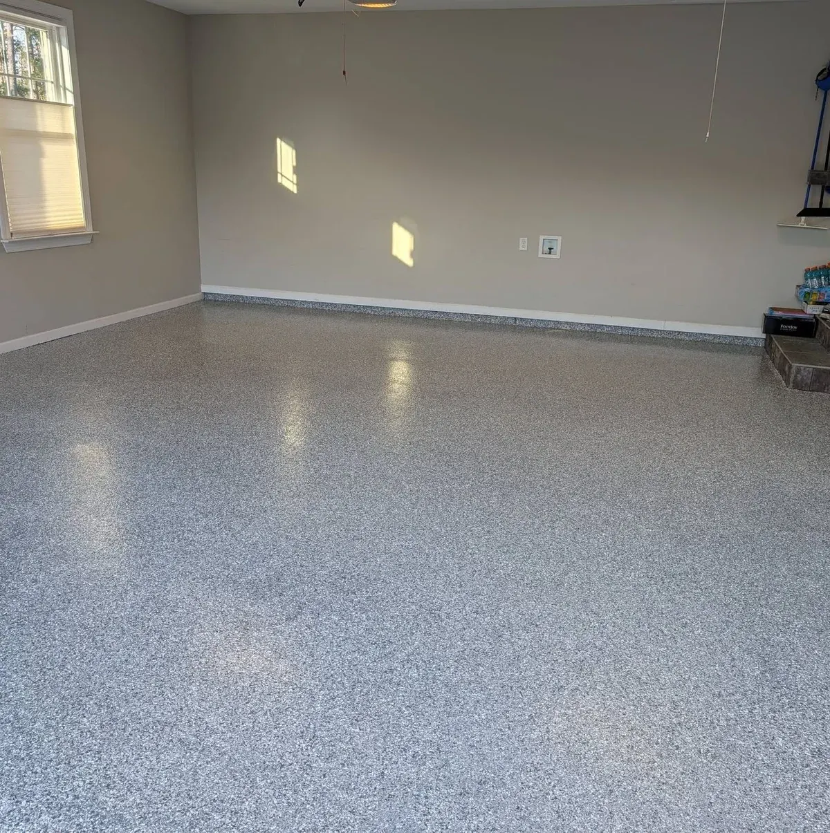 Finished glossy flake floor in a bright two-car garage