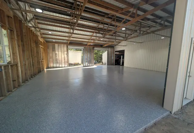 Coated warehouse floor in a long open steel building